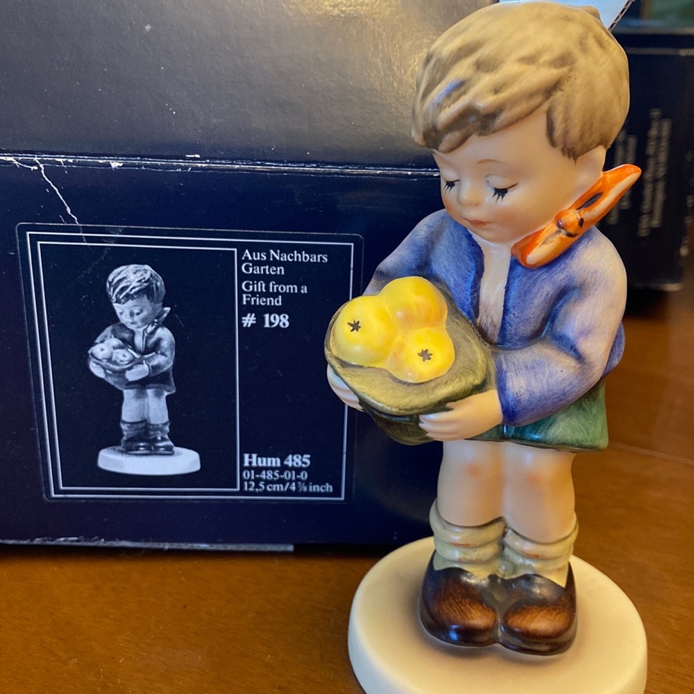 Hummel figure #198. “Gift from a Friend” very cute little boy.